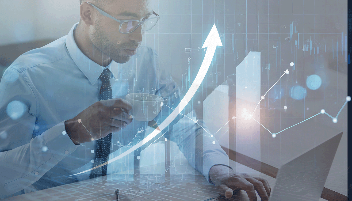 Man at laptop upward chart